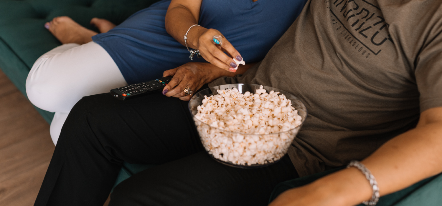 couple on couch with popcorn